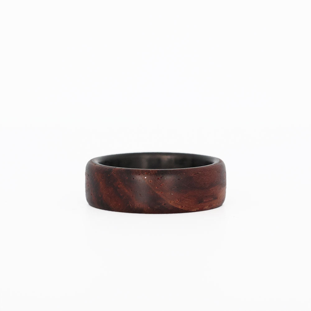 cocobolo ring with carbon fiber sleeve laying flat