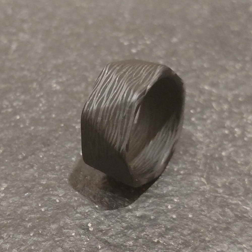 Carbon Fiber Men's Ring On The Ground