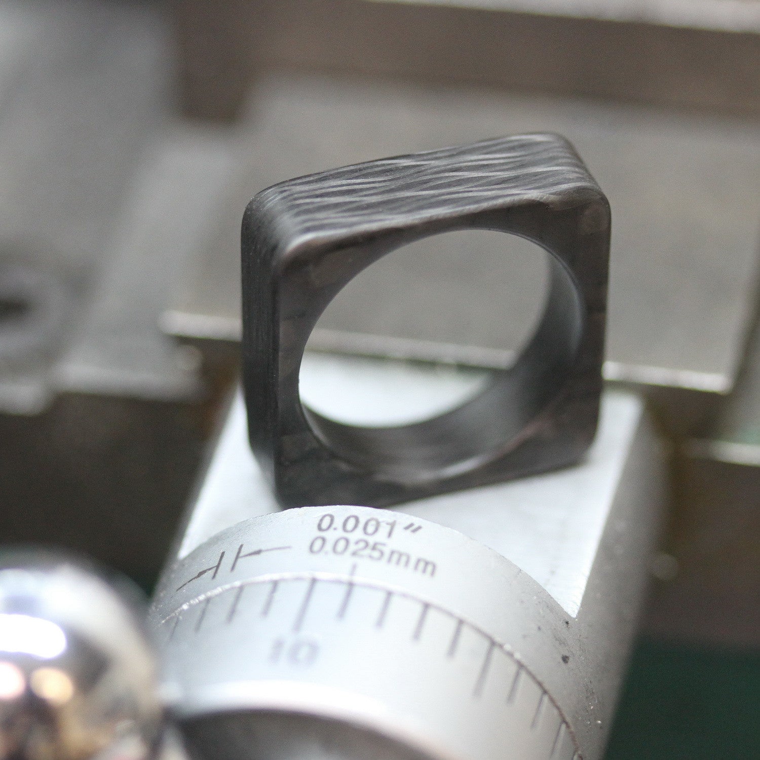 Square Carbon Fiber Wedding Ring On A Lathe