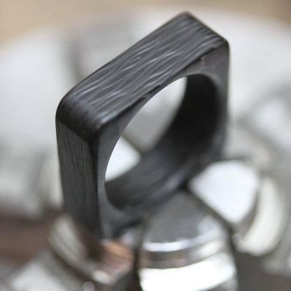 Square Carbon Fiber Wedding Ring On Lathe Jaws