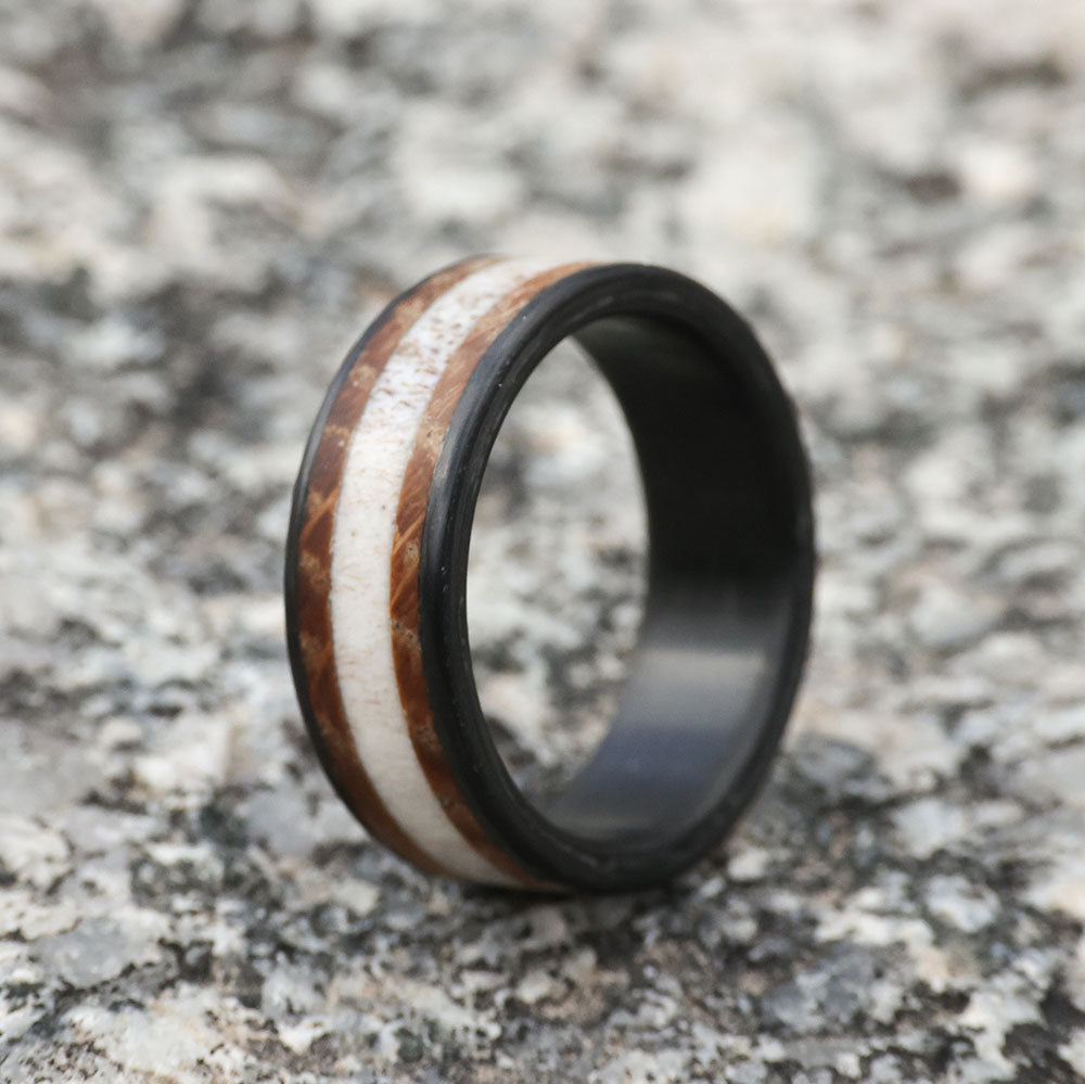 Deer Antler Men's Wedding Band with whiskey barrel and carbon fiber on Marble