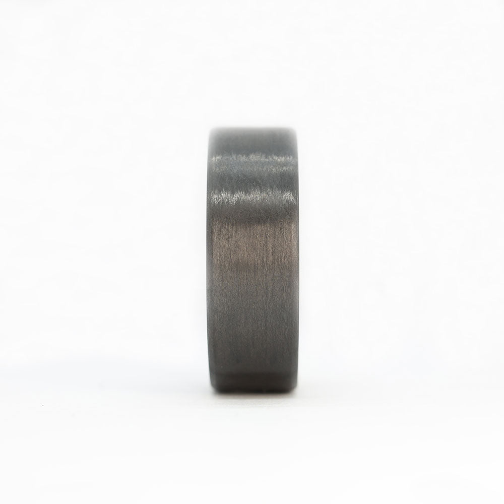 whiskey barrel wedding ring with carbon fiber exterior front view